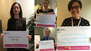 Four Heads of Profession holding up placards stating their diversity and inclusion pledges